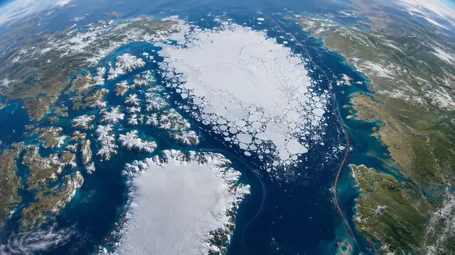 Illustrated orbital view of the Arctic Ocean, with fractured sea ice between Greenland and northern Eurasia and a dashed shipping route traced along the coastline.