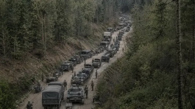 Reconstruction of a German mechanized column halted nose-to-tail along a narrow dirt road through the dense Ardennes forest, May 1940.