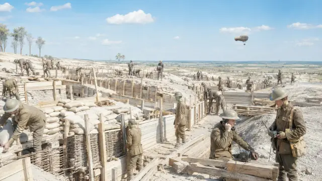 Reconstruction of a First World War trench system in chalk soil, troops along the fire step with an observation balloon and shellbursts on the horizon.
